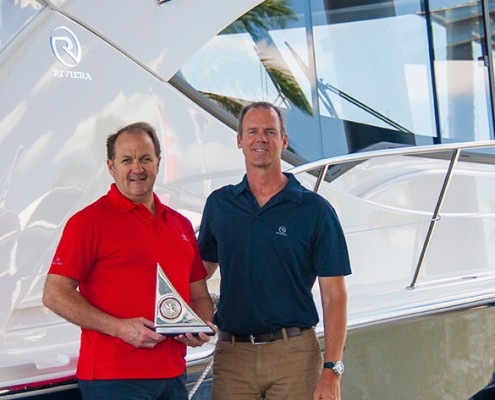 Riviera’s chief executive Wes Moxey and chairman and owner Rodney Longhurst celebrate the 565 SUV being awarded Best Motoryacht in the prestigious AIM Media Group Editor’s Choice Awards at Fort Lauderdale International Boat Show