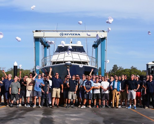 Rodney Longhurst and Riviera's team of master craftsman celebrate the launching of the new 77 Enclosed Flybridge