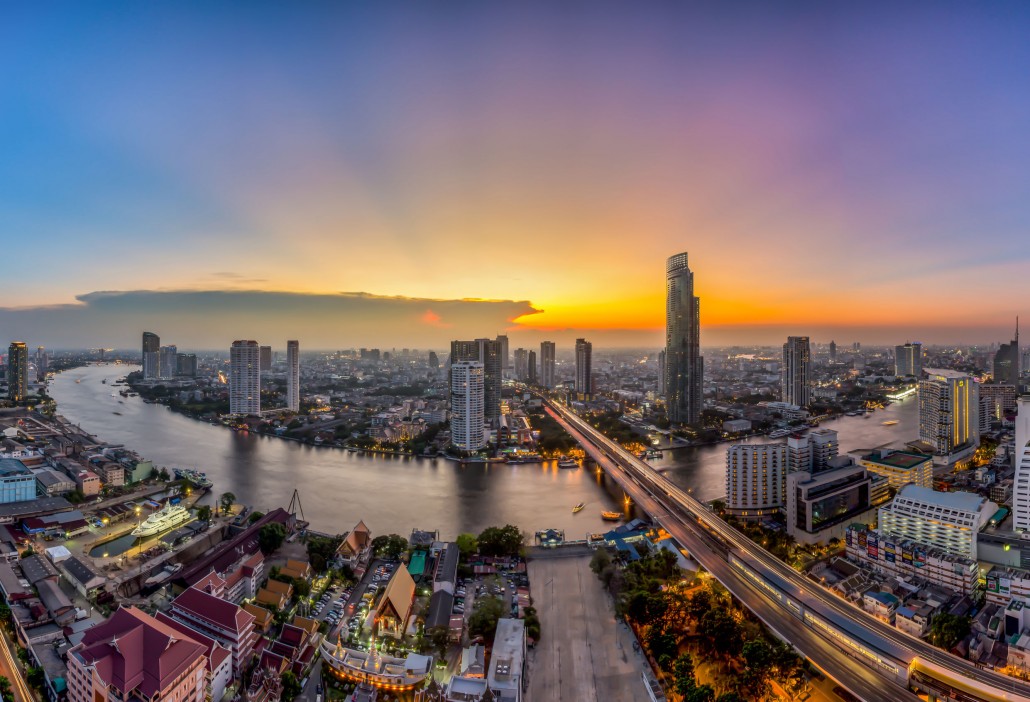 Bangkok Transportation at Dusk with Modern Business Building along the river (Thailand)