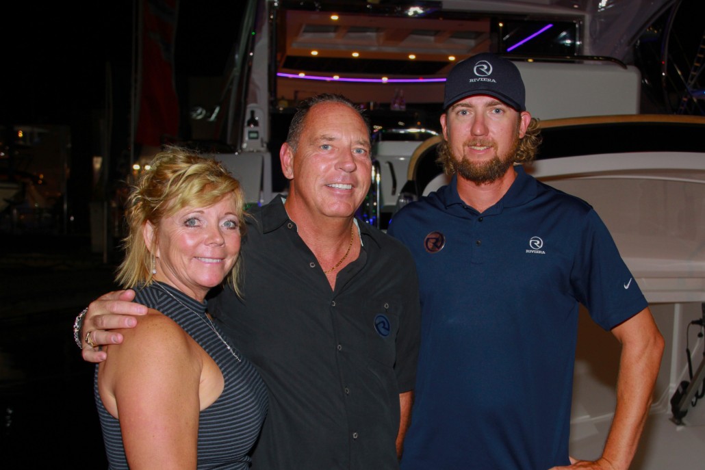 Cameron Dewhurst (right) from Riviera's Florida-based team meets and greets members of the Riviera family of owners at FLIBS