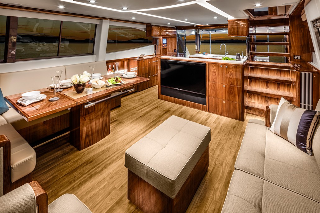 Saloon and galley form one large entertaining space on board the Riviera 68 Sports Motor Yacht.